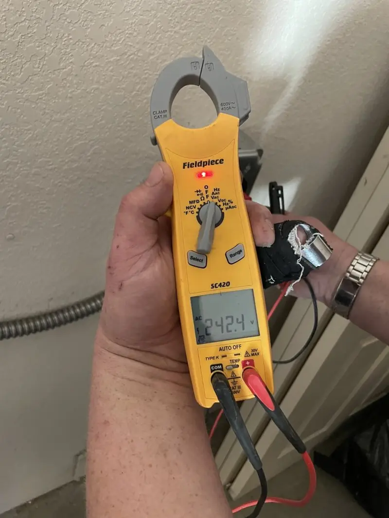 Voltage testing with clamp meter during Electrical Installation Services in Laurel
